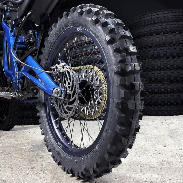 The 18" rear wheel is mounted on a Surron e-bike with OFF-ROAD tires.