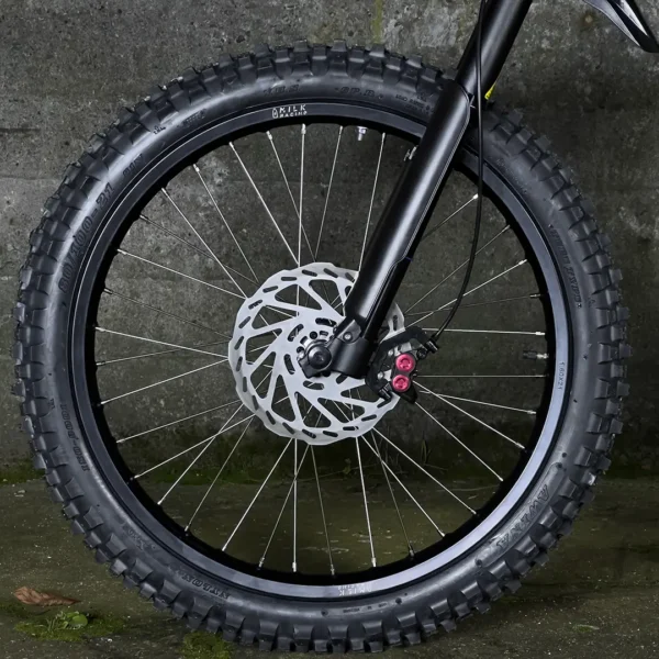 The 21" front wheel is mounted on a Talaria e-bike with OFF-ROAD tires.