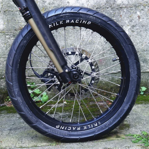 The 16” Supermoto Superlight Set is mounted on a Surron e-bike with ON-ROAD tires.