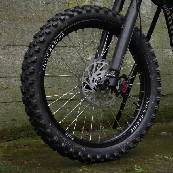 The 19" front wheel is mounted on a Talaria e-bike with OFF-ROAD tires.