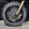 The 12” Kid Set is mounted on a Surron e-bike with OFF-ROAD tires.