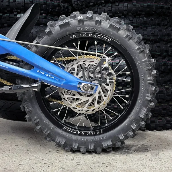 The 14” Kid Set is mounted on a Surron e-bike with OFF-ROAD tires.