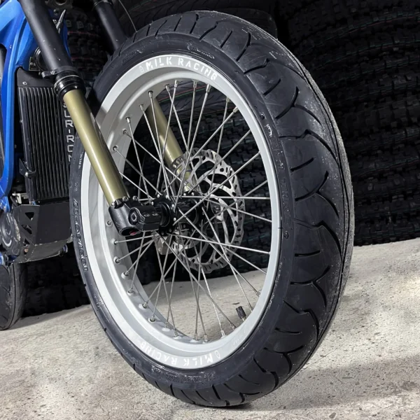 The 17" SuperMoto front wheel is mounted on a SurRon e-bike with ON-ROAD tires.